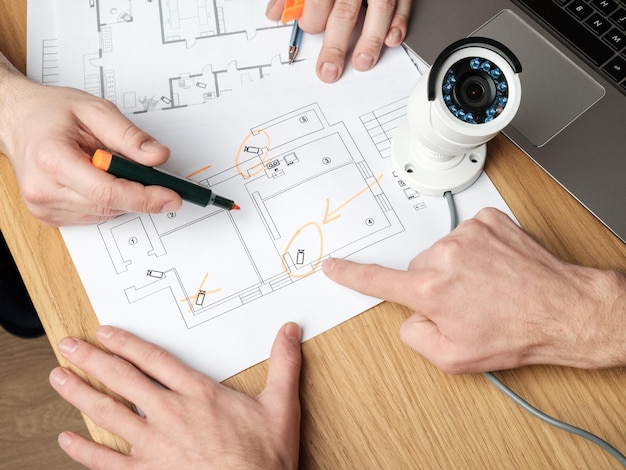 [freepicdownloader.com]-two-people-discussing-cctv-project-normal